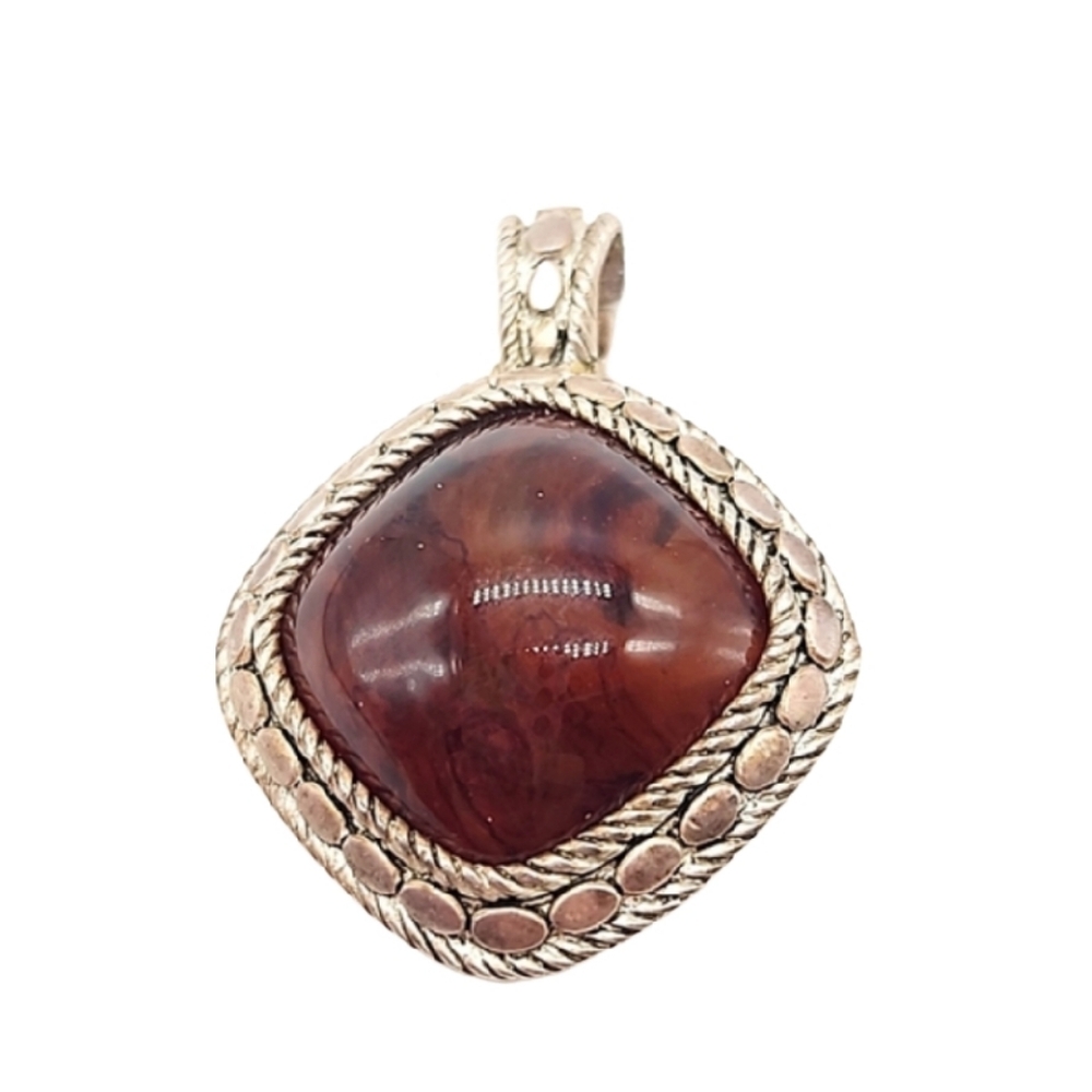 Silver pendant with brown glass stone